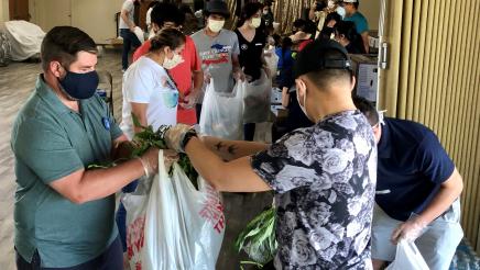 Assemblymember Arambula helped other volunteers at a free food distribution effort at Fresno Interdenominational Refugee Ministries on June 24, 2020.