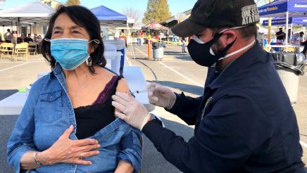  Assemblymember Dr. Joaquin Arambula, who is an emergency room physician, administers a COVID-19 vaccine to Dolores Huerta, legendary labor leader and civil rights activist, during a clinic in Del Rey on March 4, 2021.