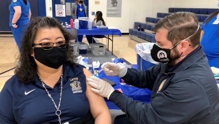 Assemblymember Dr. Joaquin Arambula administers a COVID-19 vaccine during a clinic held at Laton High School on March 2, 2021.