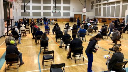 People wait the required 15 minutes after receiving their second doses of a COVID-19 vaccine during a clinic held in Orange Cove on March 9, 2021. Assemblymember Dr. Joaquin Arambula and partners collaborated on the event.