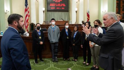 Assemblymember Dr. Joaquin Arambula and Assemblymember Jim Patterson welcome members of the champion University High School Academic Decathlon team of Fresno to the Assembly Floor on June 6, 2022. The team won the Small Schools national title at the 2022 U.S. Academic Decathlon, making it the school's 14th national A.D. championship.