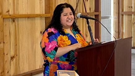 Dr. Tania Pacheco-Werner addresses the luncheon gathering. She is Assemblymember Arambula’s honoree as the AD 31 Woman of the Year for 2022.