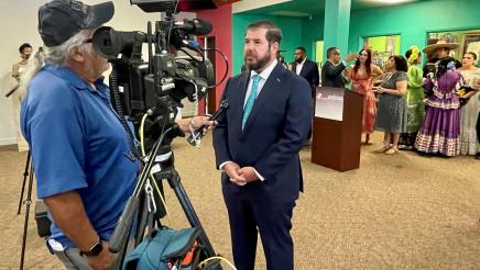 Assemblymember Arambula talks about the State allocation with a media member.