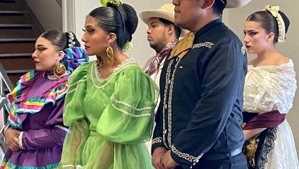 Mariachi dancers listen to speakers at the Sept. 7 2022 news conference about $7 million in State funds allocated to Arte Américas, the only Latino cultural arts center in the Central Valley.