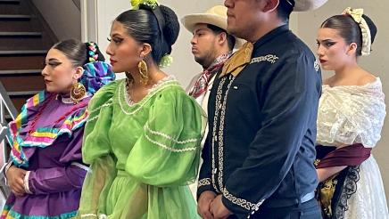 Mariachi dancers listen to speakers at the Sept. 7 2022 news conference about $7 million in State funds allocated to Arte Américas, the only Latino cultural arts center in the Central Valley.