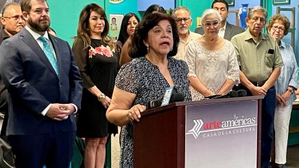 Lilia Chavez speaks the press conference. She is executive director of the Fresno Arts Council and a past council member of the California Arts Council.