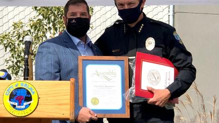Assemblymember Dr. Joaquin Arambula presents a certificate in recognition of the opening of the new Selma Police headquarters to Selma Police Chief Joe Gomez.