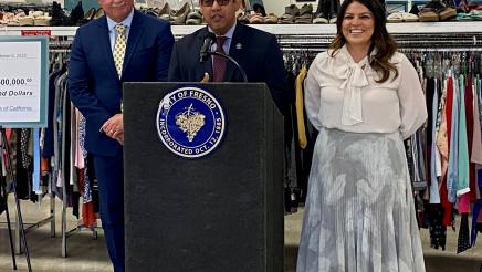 Fresno City Councilman Miguel Arias speaks at the press conference in Fresno’s Tower District, where Neighborhood Industries is based. With him are (left) Mayor Jerry Dyer and City Councilwoman Esmeralda Soria.