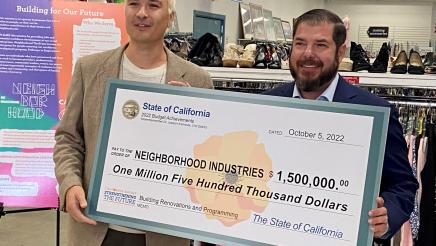 Assemblymember Arambula and Anthony Armour, CEO of Neighborhood Industries in Fresno, are shown with the $1.5 million check representing the State allocation.