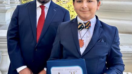 Assemblymember Dr. Joaquin Arambula and his honoree Malachi Suarez, a Central Unified School District student, are seen on a portico at the State Capitol on Aug. 17, 2023.
